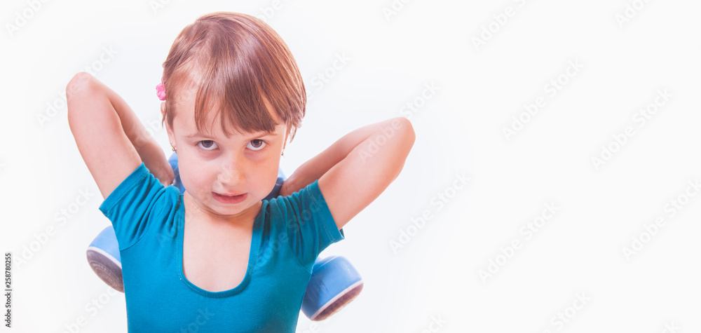Little cute female sportler with dumbbells as symbol of best investment in health of children in future. Little cute female sportler with dumbbells as symbol of best investment in health of children in future.