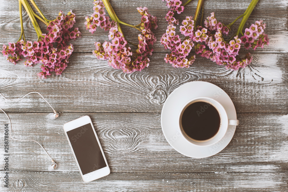 Social media flat lay with coffee, flowers and smartphone on gray wooden table. Social media flat lay with coffee, flowers and smartphone on gray wooden table.