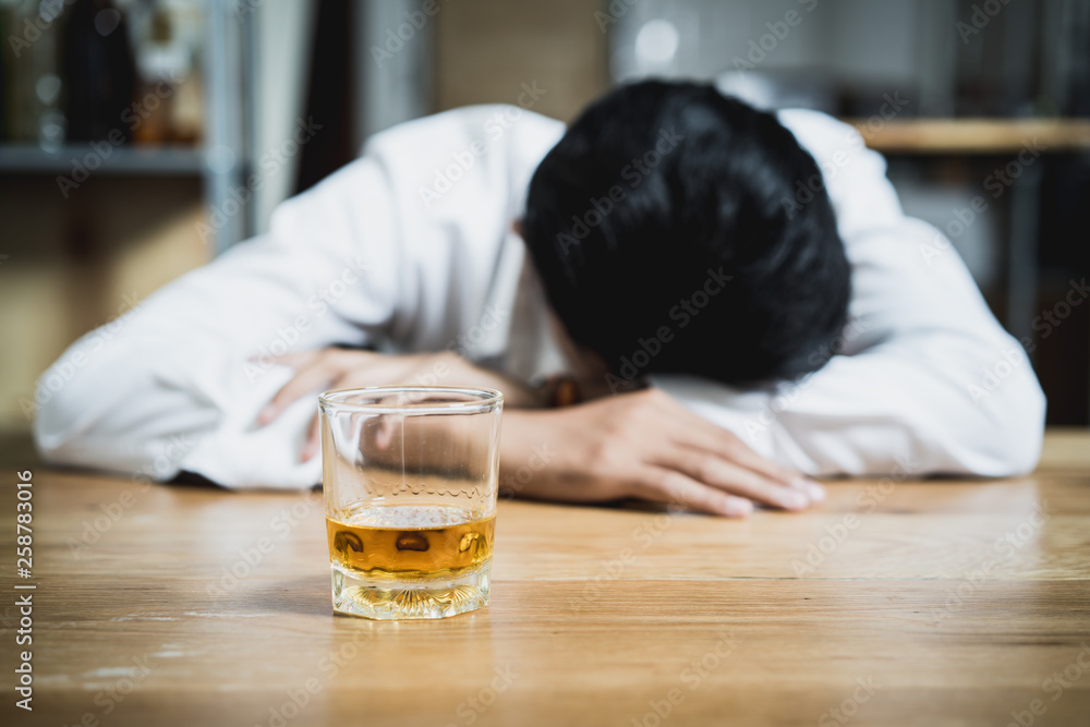 drunkard fall asleep on the table at bar. drunkard fall asleep on the table at bar.