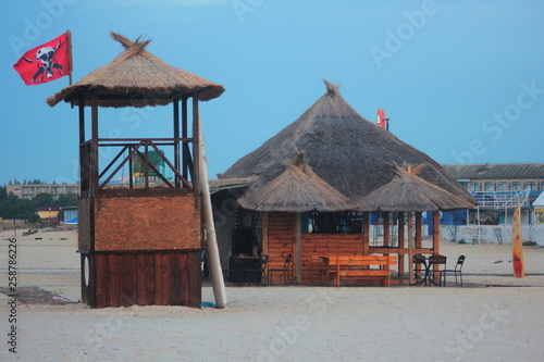  Bar and wooden tower on the sand.
