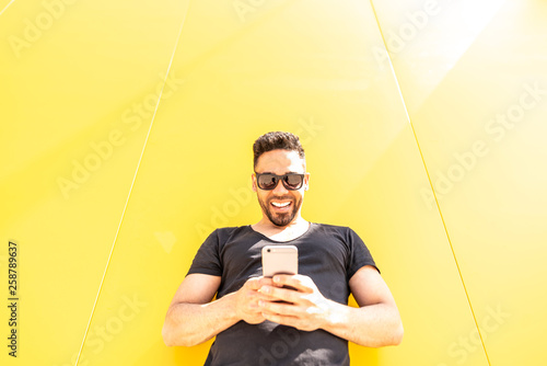 Young Man Using Cellphone.