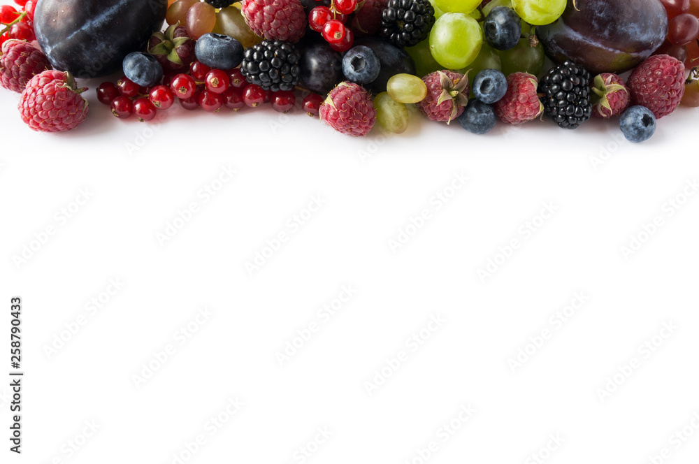 Mix berries on a white background. Ripe red currants, grapes, blackberries, blueberries, raspberries and plums on white background. Top view. Fruits with copy space for text. Mix berries and fruits. Mix berries on a white background. Ripe red currants, grapes, blackberries, blueberries, raspberries and plums on white background. Top view. Fruits with copy space for text. Mix berries and fruits.