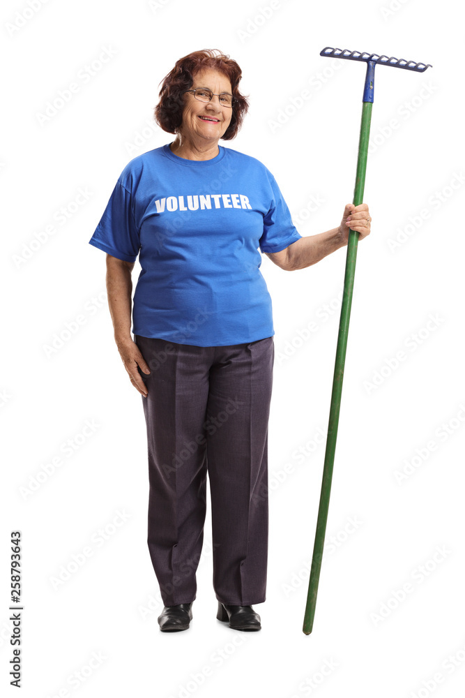 Elderly woman volunteer with a rake Elderly woman volunteer with a rake