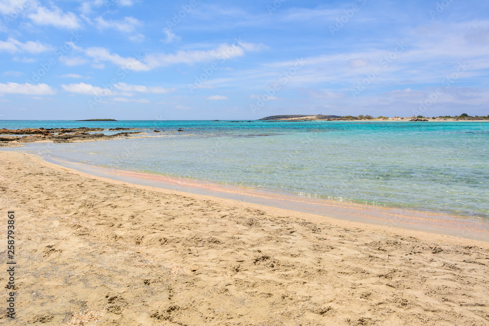 Elafonisi - a beach with pink sand, warm and crystal clear water. Crete Island, Greece Elafonisi - a beach with pink sand, warm and crystal clear water. Crete Island, Greece