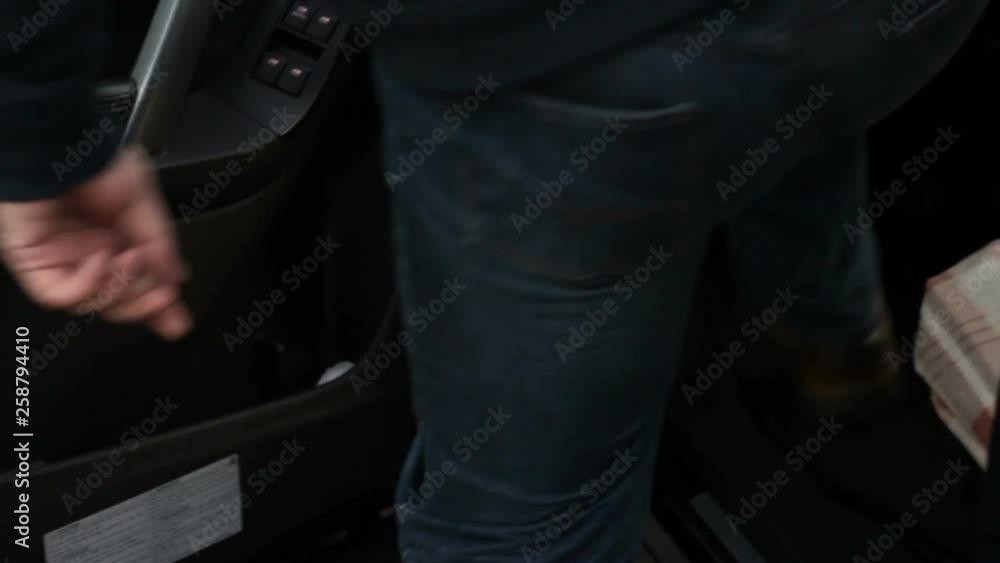 Man open the car door to sit on the driver's seat Man open the car door to sit on the driver's seat