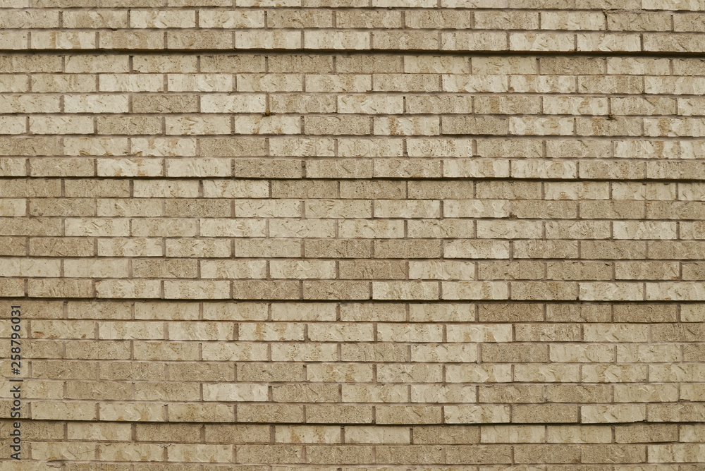 Old beige brick wall background texture Old beige brick wall background texture