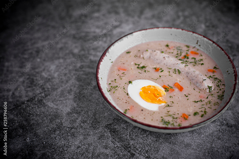 Easter breakfast. Sour rye soup with eggs and sausage Easter breakfast. Sour rye soup with eggs and sausage