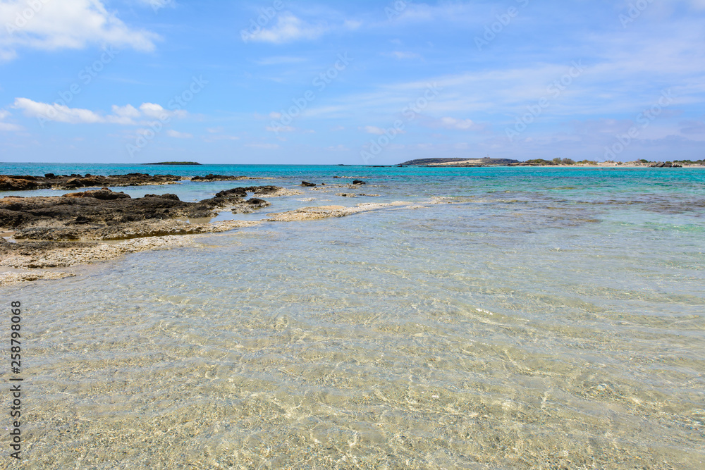 Obraz premium Elafonisi beach with crystal clear water in summer day. Crete Island, Greece
