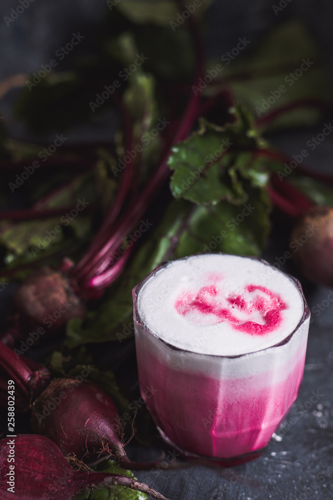 Beetroot drink. Healthy beetroot latte with whole beetroots on table. Close up. Beetroot drink. Healthy beetroot latte with whole beetroots on table. Close up.