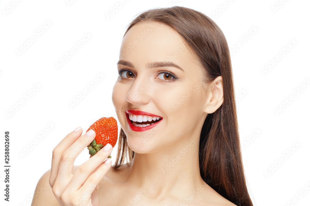 Beautiful happy girl with clean and healthy skin biting strawberry. Cosmetology , treatment, beauty and spa . Skin care and aromatherapy. Beautiful happy girl with clean and healthy skin biting strawberry. Cosmetology , treatment, beauty and spa . Skin care and aromatherapy.