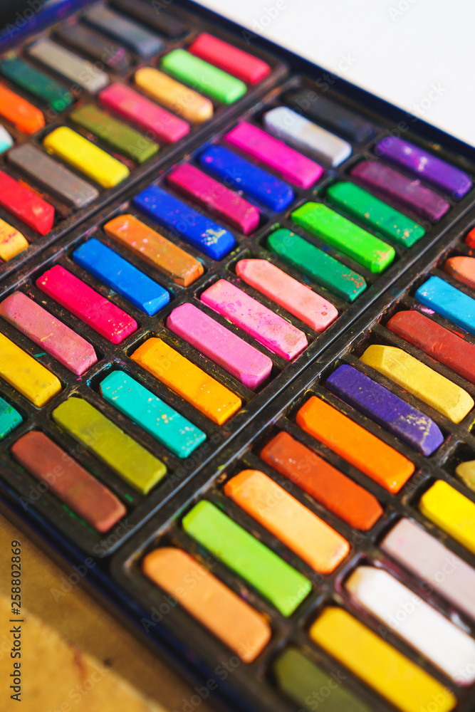 Pastel crayons paint special palette box. Accessories and tools of the artist for drawing. Pastel crayons paint special palette box. Accessories and tools of the artist for drawing.