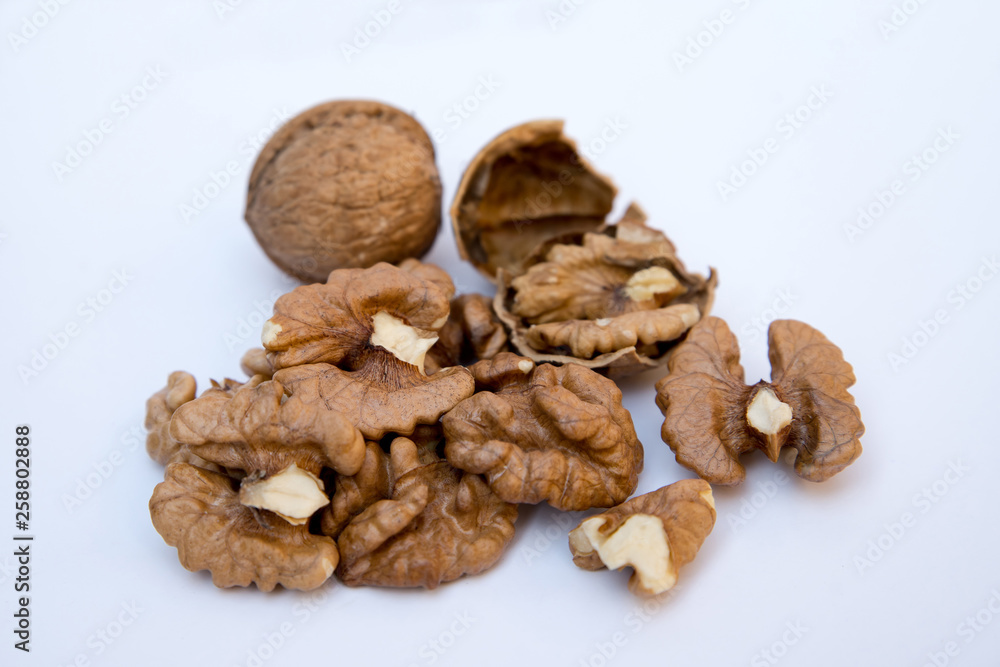 Isolated nuts pattern backdrop. Close-up of walnut kernels. Isolated nuts pattern backdrop. Close-up of walnut kernels.