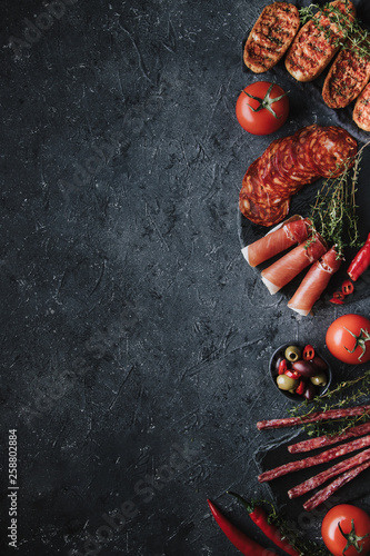 Spanish tapas on black background with copy space.