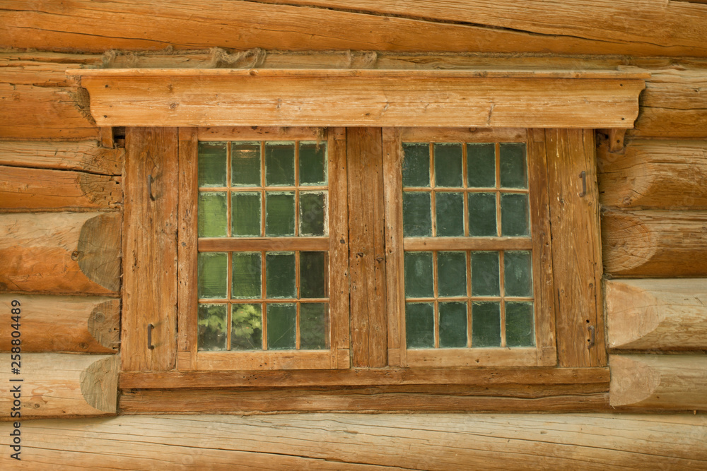 The old window in the wooden house