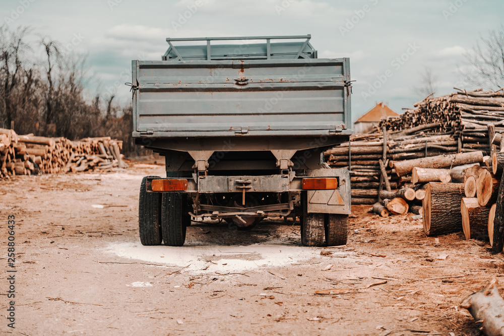 Obraz premium Picture of big truck in sawmill waiting to be loaded.
