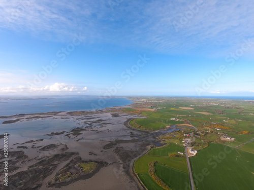 Aerial view of green fields and coast of Irish Sea in Northern Ireland. Coastal Route  © Maciej