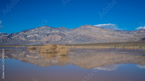 death valley during a rare flood in a dry lake bed, near the Panamint mountains, March 2019.
