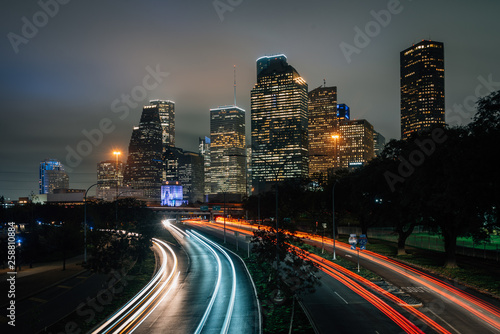 Long exposure of traffic on Allen Parkway and the Houston skyline at night, in Houston, Texas © jonbilous