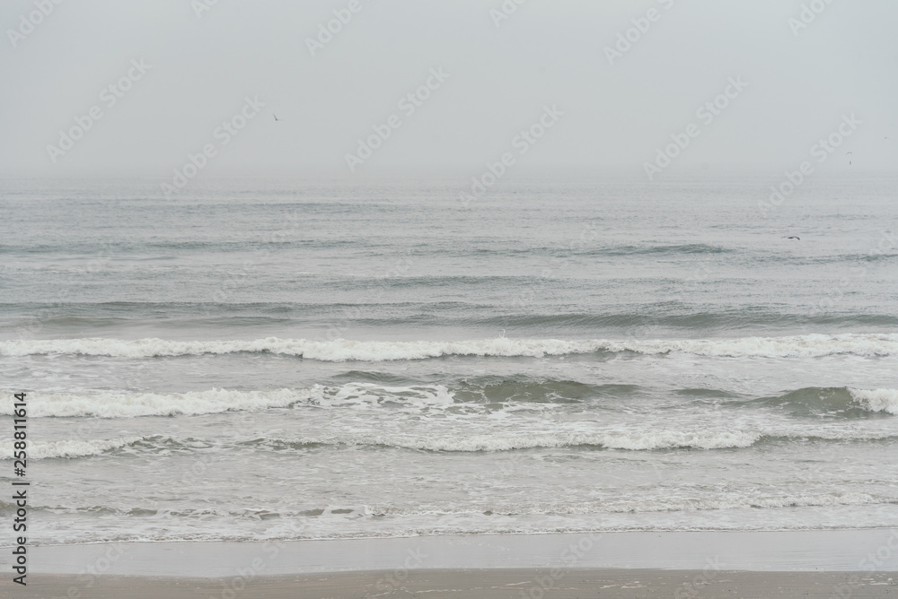 Waves in the Gulf of Mexico on a cloudy day in Galveston, Texas Waves in the Gulf of Mexico on a cloudy day in Galveston, Texas