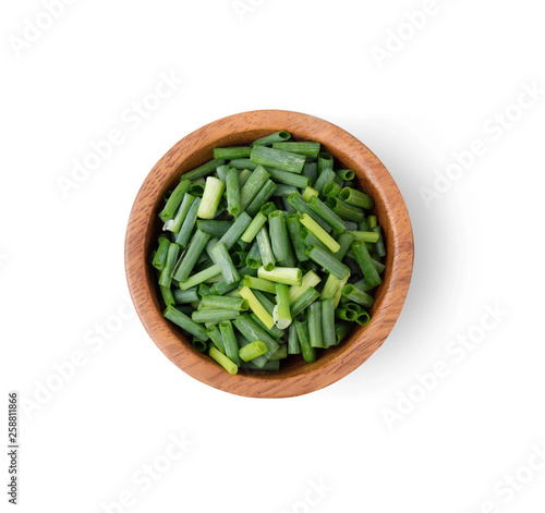 green onion slice in wood bowl isolated on white background