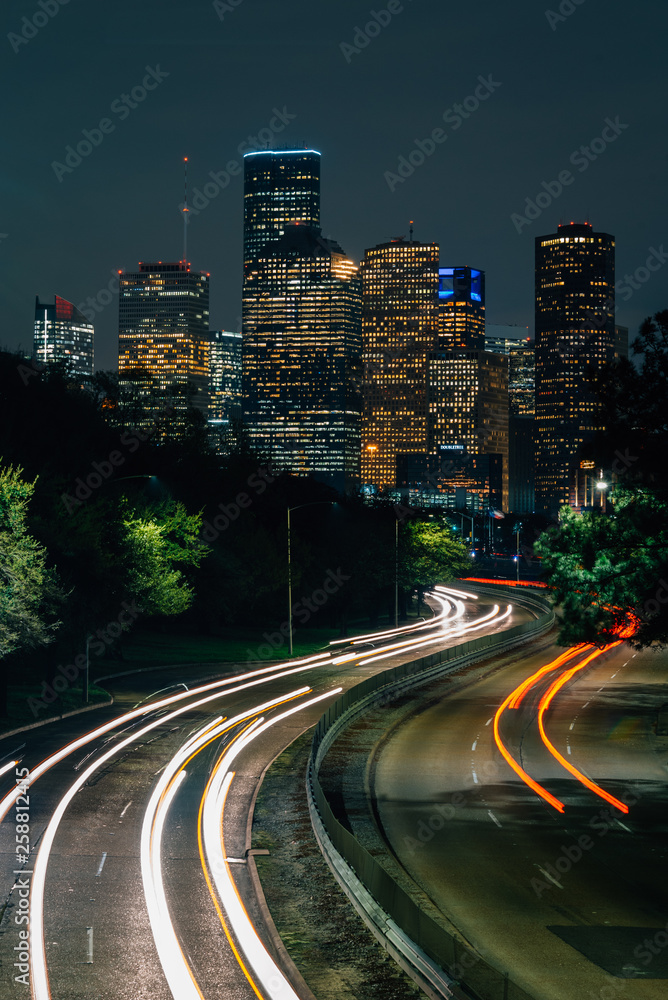 Memorial Drive and the Houston skyline at night, in Houston, Texas
