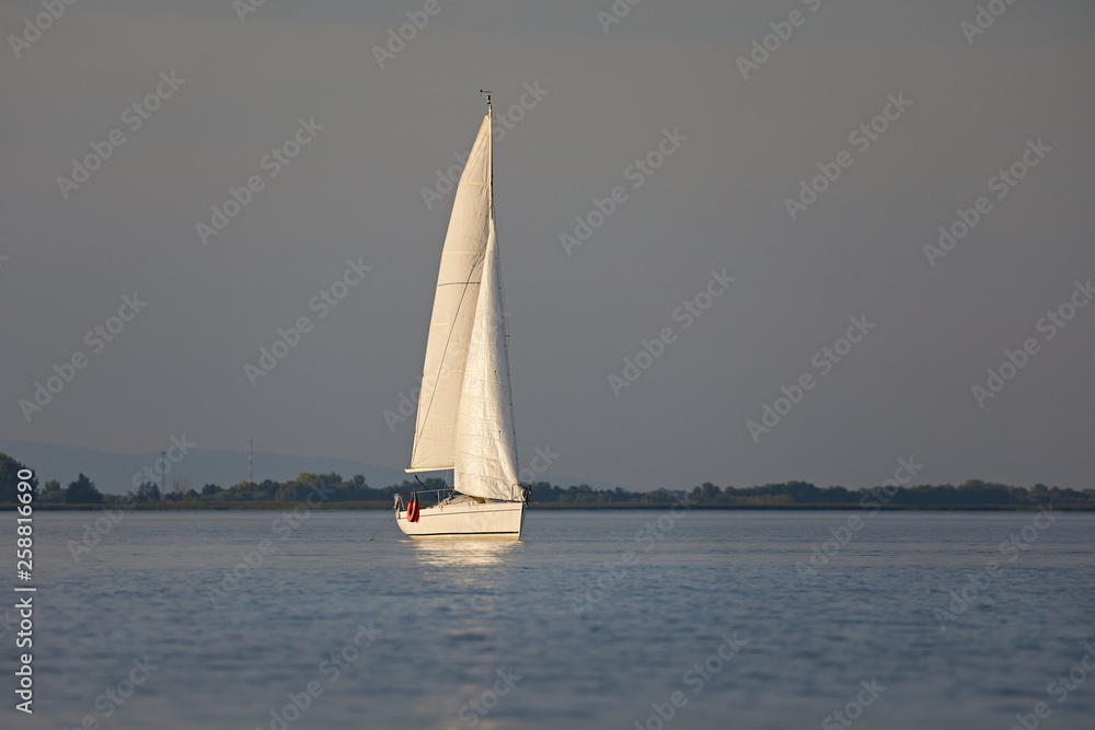 Sailing boat in dusk light