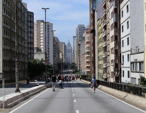 People walk around enjoying the sun and the scenery 