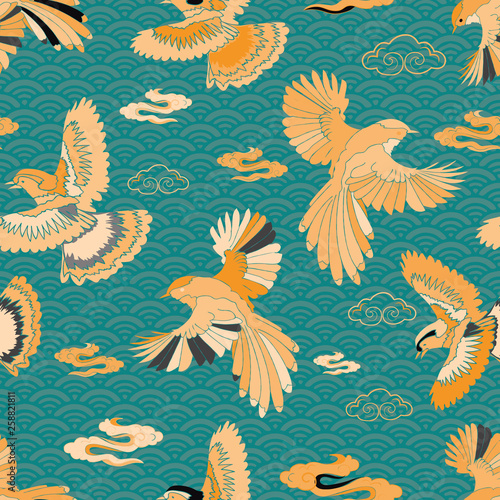 Illustration of birds, blue jay, falcon, waves and clouds. Seamless repeat pattern in yellow, blue, green, cream, black, turquoise and grey.