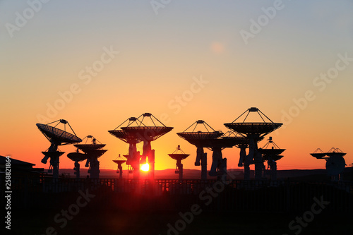 Observatory equipment  silhouette at sunrise