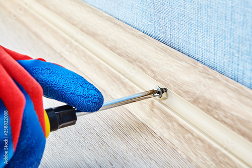 Obraz na plátně Twisting PVC plinth in cable channel.