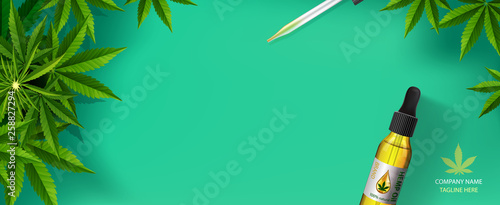 Marijuana plant and drop oil, green background.