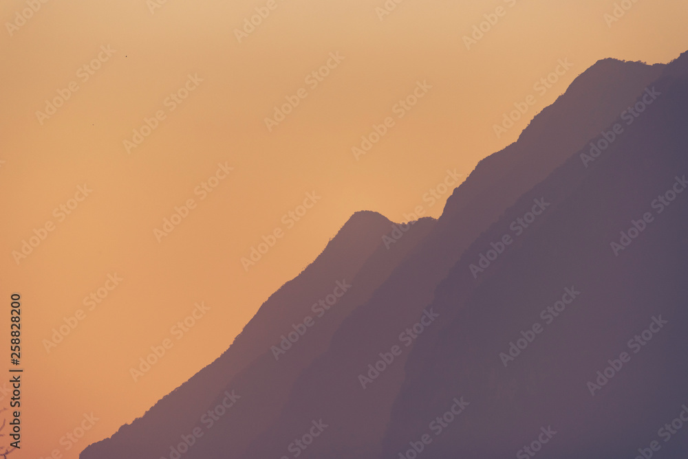 sunset with the mountain layers, tropical forest, Asian mountain