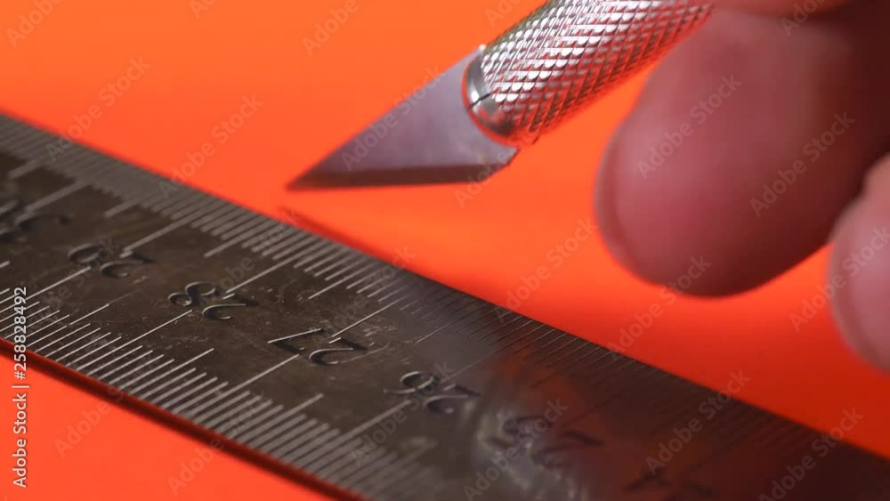 Using A Scalpel To Cut A Straight Line On A Cardboard Piece using-a-scalpel-to-cut-a-straight-line-on-a-cardboard-piece