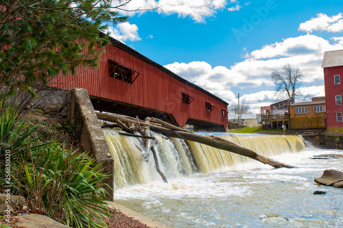 Standing on the banks of the river near the covered bridge  in Bridgeton, Indiana photo