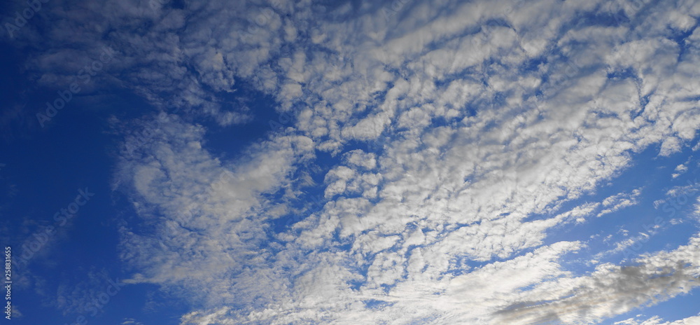 Beautiful blue sky with clouds close up.