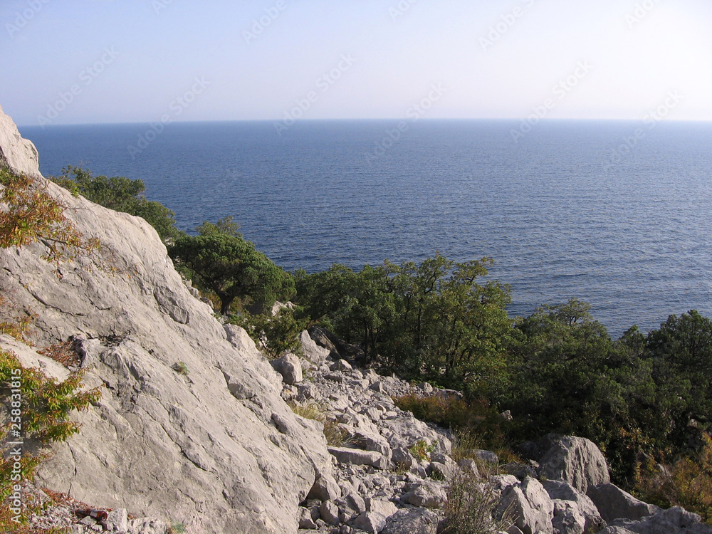 mountain panoramic landscape with a high cliff on the horizon ocean sea view of the traveler in the mountains of Crimea