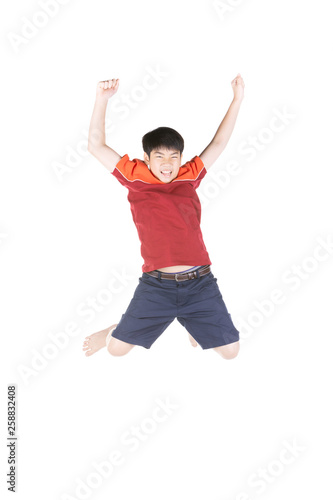 Asian funny child boy jumping on white background.