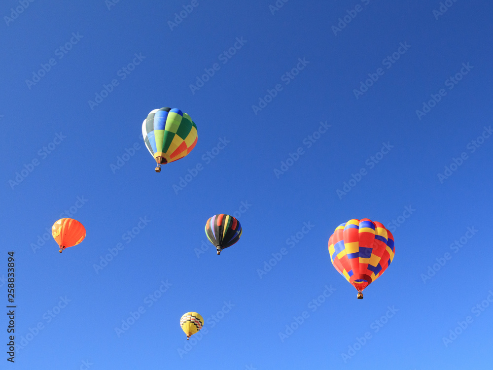Colorful hot air balloons with blue sky in background Colorful hot air balloons with blue sky in background