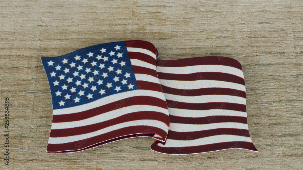 Obraz premium American flag close up on wood background