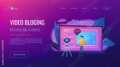 A man in front of camera recording a video to share it in internet. Vloger shares a bradcast in blog or video log. Video bloging, web television or embedded video concept. Website landing web page.