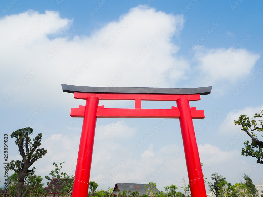 Red torii with background blue sky.