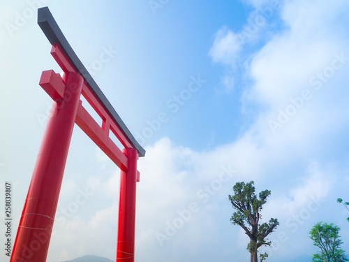 Red torii with background blue sky.