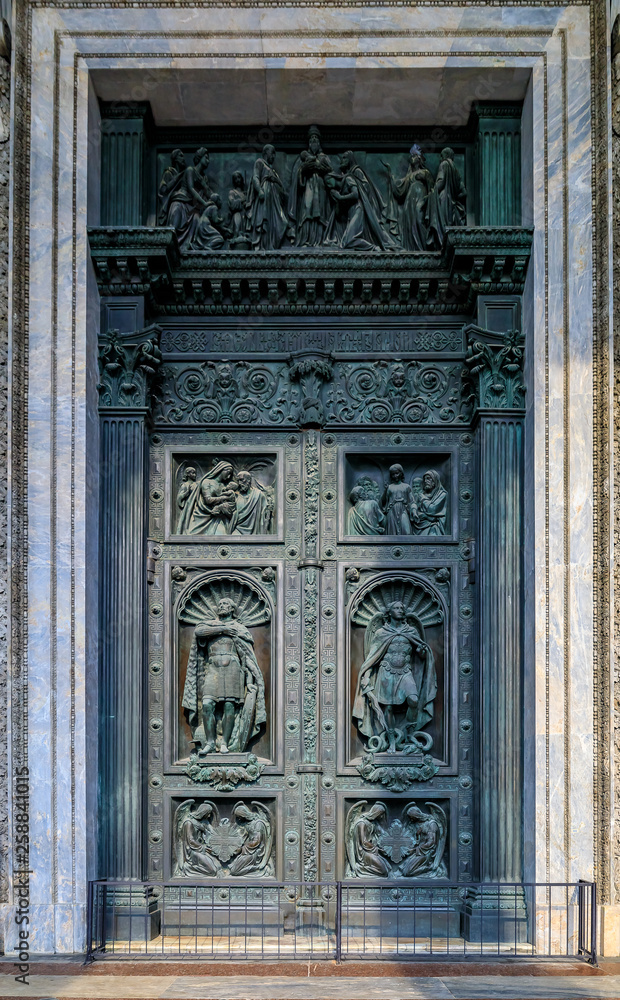 Ornate details of the large bronze doors of Saint Isaac's Russian Orthodox Cathedral  in Saint Petersburg, Russia