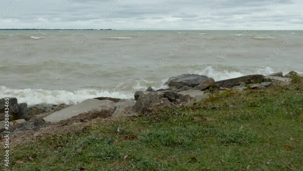Waves crash upon a rocky shoreline. Waves crash upon a rocky shoreline.