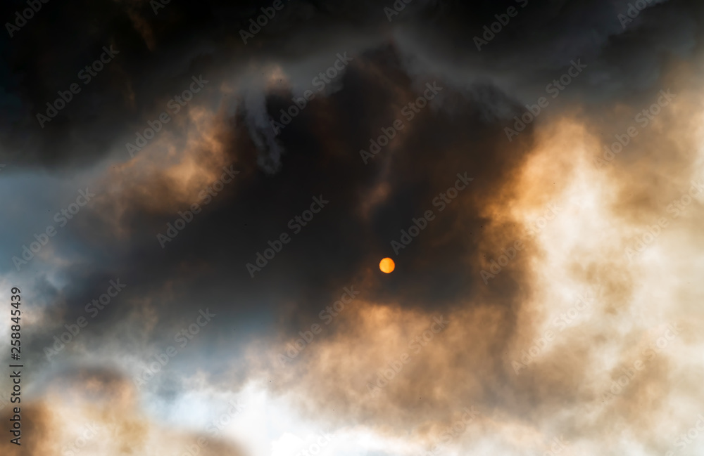 Fototapeta premium Thick black acrid smoke on the sky background