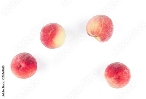 Overhead view of peaches isolated on white background