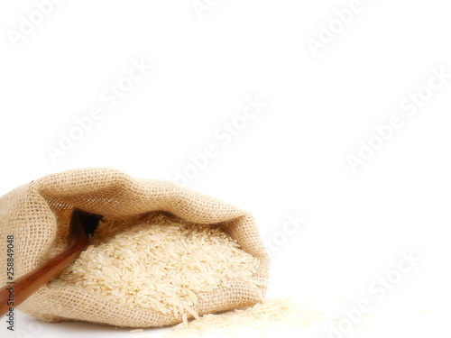 rganic rice or raw rice in sack isolate on white background