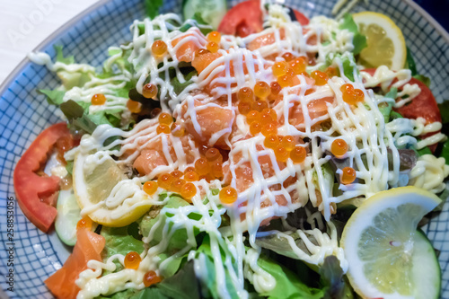 Vegetable salad salmon and salmond roe. photo