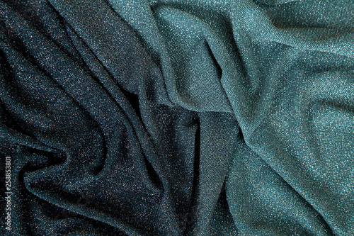 rainbow lurex fabric - the transition from light green to dark burgundy lined with different folds