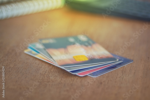 Credit card or debit card on working table ,shopping online concept.
